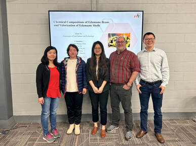 Group photo celebrating Daisy Yu's PhD defense