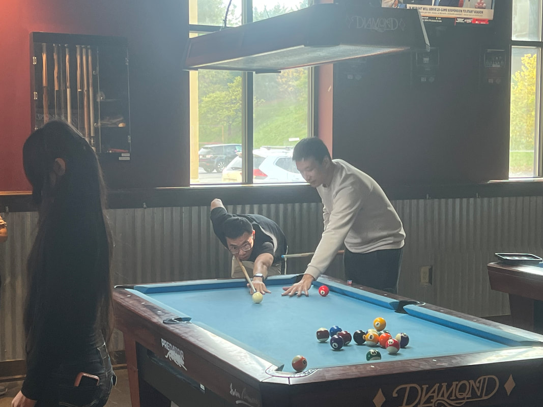 Xuanbo Liu playing pool